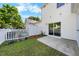 Backyard patio with white fence and greenery at 1204 Maroon Dr, Durham, NC 27713