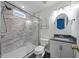 Modern bathroom with a marble-tiled shower and contemporary fixtures at 1204 Maroon Dr, Durham, NC 27713