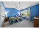 Bright bedroom features two twin beds, a ceiling fan, and a large window at 1204 Maroon Dr, Durham, NC 27713