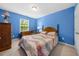 Cozy bedroom showcases a comfortable bed with a decorative headboard and quilt at 1204 Maroon Dr, Durham, NC 27713