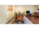 Inviting dining room with a glass-top table, colorful rug, and ample natural light at 1204 Maroon Dr, Durham, NC 27713