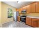 Functional kitchen with stainless steel appliances and ample cabinet space at 1204 Maroon Dr, Durham, NC 27713