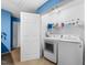 Laundry closet with a modern washer and dryer at 1204 Maroon Dr, Durham, NC 27713