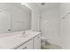 Bright bathroom features a single sink vanity with bright vanity lighting and a tub-shower combo at 121 Cribbs Ln, Middlesex, NC 27557