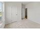 Neutral bedroom with plush carpeting, an ensuite bathroom, and closet at 121 Cribbs Ln, Middlesex, NC 27557