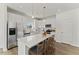 Modern kitchen with white cabinetry, stainless steel appliances, and a large island at 121 Cribbs Ln, Middlesex, NC 27557