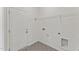 A tidy laundry room features patterned tile flooring, a wire shelf, and a white door at 121 Cribbs Ln, Middlesex, NC 27557