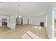 Open living space with a fireplace, hardwood floors, and an island kitchen at 121 Cribbs Ln, Middlesex, NC 27557