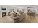 Open-concept living room with fireplace, modern kitchen, and plenty of natural light at 121 Cribbs Ln, Middlesex, NC 27557