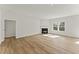 Spacious living room with fireplace, hardwood floors, and plenty of natural light at 121 Cribbs Ln, Middlesex, NC 27557