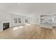 Bright, open-concept living space with hardwood floors, fireplace, and access to the backyard at 121 Cribbs Ln, Middlesex, NC 27557