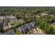 A beautiful aerial view of townhomes, showcasing their neat arrangement and proximity to mature tree cover at 124 Myatt Fern Dr, Garner, NC 27529