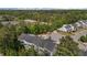 An aerial shot reveals townhomes nestled among trees and landscaping, with a community building nearby at 124 Myatt Fern Dr, Garner, NC 27529