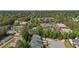 Scenic aerial view of the community with lush greenery, buildings, and a glimpse of the city skyline in the distance at 124 Myatt Fern Dr, Garner, NC 27529