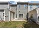 Home backyard with a fenced lawn and covered patio, perfect for relaxation and outdoor enjoyment at 124 Myatt Fern Dr, Garner, NC 27529
