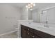 Elegant bathroom featuring a double sink vanity with a marble countertop, with tile floors and great lighting fixtures at 124 Myatt Fern Dr, Garner, NC 27529