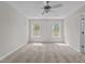 Bright bedroom with ample natural light and neutral color scheme at 124 Myatt Fern Dr, Garner, NC 27529
