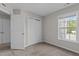 Cozy bedroom with ample closet space, natural light, and carpeted floors creating a warm atmosphere at 124 Myatt Fern Dr, Garner, NC 27529