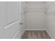 Walk-in closet with carpeted floors and wire shelving for organized storage, perfect for any wardrobe at 124 Myatt Fern Dr, Garner, NC 27529