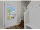 Entryway featuring a white door with a view, stairs, and a mudroom bench at 124 Myatt Fern Dr, Garner, NC 27529
