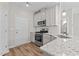 Close up of well-equipped kitchen showcasing a modern oven and subway tile backsplash at 124 Myatt Fern Dr, Garner, NC 27529