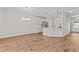 Open-concept kitchen with modern white cabinets, stainless steel appliances, and an island at 124 Myatt Fern Dr, Garner, NC 27529