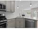 Open kitchen view of the island and living space with fireplace at 124 Myatt Fern Dr, Garner, NC 27529