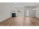Spacious living room with a fireplace, large windows, and ample natural light at 124 Myatt Fern Dr, Garner, NC 27529