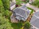 Aerial view showcasing the home's backyard with a patio and lush landscaping at 12428 Penrose Trl, Raleigh, NC 27614
