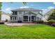 Large backyard featuring a stone patio and well maintained lawn at 12428 Penrose Trl, Raleigh, NC 27614