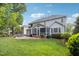 Large backyard featuring a stone patio and well maintained lawn at 12428 Penrose Trl, Raleigh, NC 27614