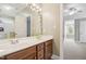 Bathroom with double sink vanity and attached shower-tub with patterned stickers at 12428 Penrose Trl, Raleigh, NC 27614