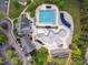 Aerial view showcasing the community pool, splash pad, and surrounding amenities at 12428 Penrose Trl, Raleigh, NC 27614