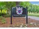 Close-up view of the community sign amid the landscaped entrance at 12428 Penrose Trl, Raleigh, NC 27614