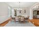 Elegant dining room with a chandelier and wainscoting, perfect for formal dinners and gatherings with guests at 12428 Penrose Trl, Raleigh, NC 27614