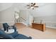 Spacious home office with vaulted ceiling, ceiling fan, and natural light at 12428 Penrose Trl, Raleigh, NC 27614