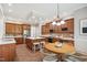 Gourmet kitchen featuring a large island, modern appliances, and a cozy breakfast area at 12428 Penrose Trl, Raleigh, NC 27614