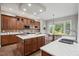 Well-appointed kitchen with stainless steel appliances, custom cabinetry, and a breakfast nook at 12428 Penrose Trl, Raleigh, NC 27614