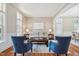 Cozy living room featuring comfortable seating, neutral tones, and abundant natural light at 12428 Penrose Trl, Raleigh, NC 27614