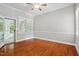 Bright living room featuring french doors, wood floors, and natural light at 12428 Penrose Trl, Raleigh, NC 27614