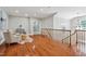 Loft area with comfortable seating, hardwood floors, and natural light, creating a relaxing and versatile space at 12428 Penrose Trl, Raleigh, NC 27614
