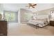 Bright main bedroom featuring large windows, neutral color palette, and adjoining sitting area at 12428 Penrose Trl, Raleigh, NC 27614