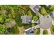 Overhead shot of a property with a well-manicured lawn, patio, and nearby homes at 1302 Ingle Ct, Burlington, NC 27215