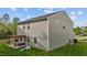 Exterior shot of the home featuring a well-maintained lawn, pergola, and patio seating area at 1302 Ingle Ct, Burlington, NC 27215