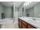 Bathroom with double sink vanity, separate shower, and bathtub at 1302 Ingle Ct, Burlington, NC 27215