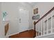 Welcoming foyer with hardwood floors, a staircase, and a front door at 1302 Ingle Ct, Burlington, NC 27215