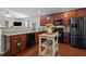 Well-equipped kitchen with modern appliances, dark cabinetry, and a functional island at 1302 Ingle Ct, Burlington, NC 27215