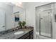 Elegant bathroom featuring a granite vanity, mirror, and glass shower at 1601 Garden Park Cir, Fuquay Varina, NC 27526