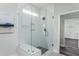 Clean, bright bathroom featuring glass shower, white subway tile and built in bench at 1601 Garden Park Cir, Fuquay Varina, NC 27526