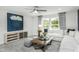 Comfortable living room with large sectional, contemporary décor, and plenty of natural light at 1601 Garden Park Cir, Fuquay Varina, NC 27526